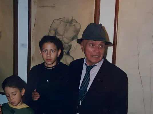 Edgar David Buitrago as a child alongside master Edgar Negret in his studio.